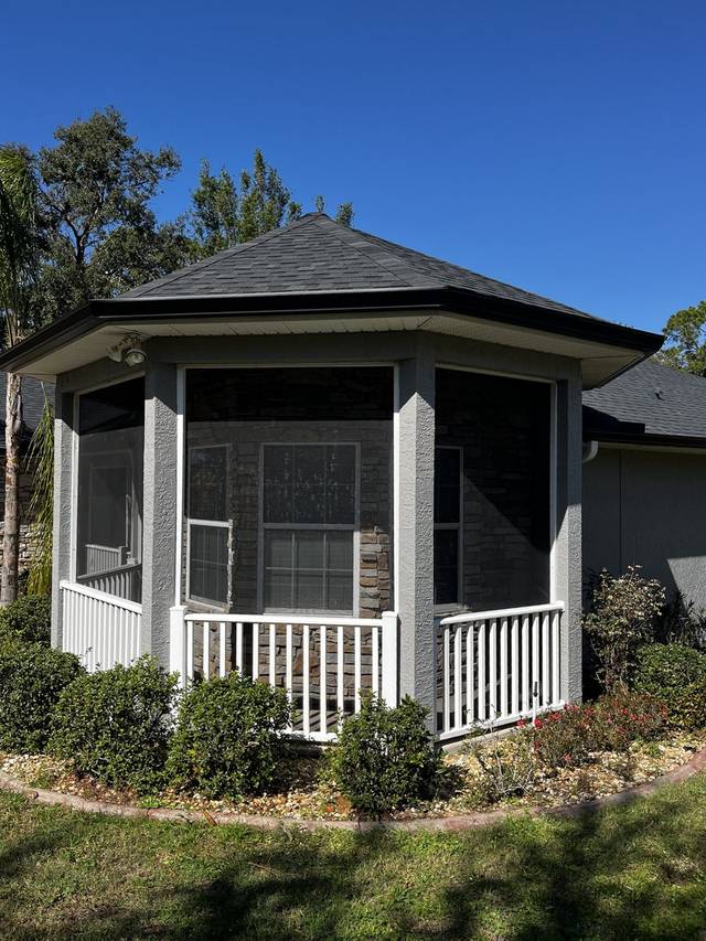 Gutter along the roofline of a screened octagonal porch